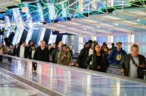A Thanksgiving tradition returns: busy roads, crowded airports